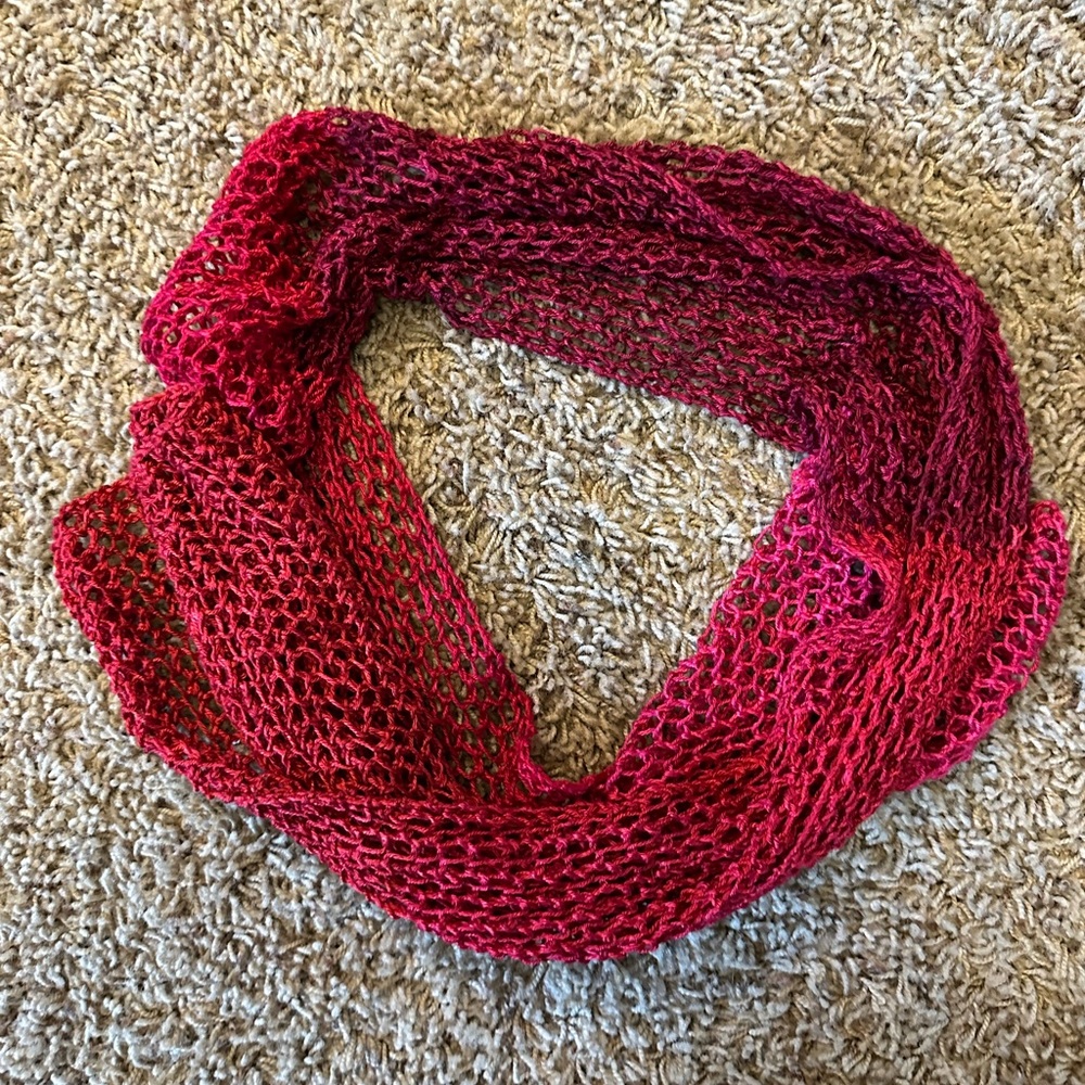 Handmade open weave scarf in reds and pinks